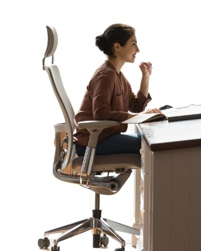 woman with brown hair and brown shirt sitting in office chair - arm rests are at proper height with elbows resting at 90 degrees